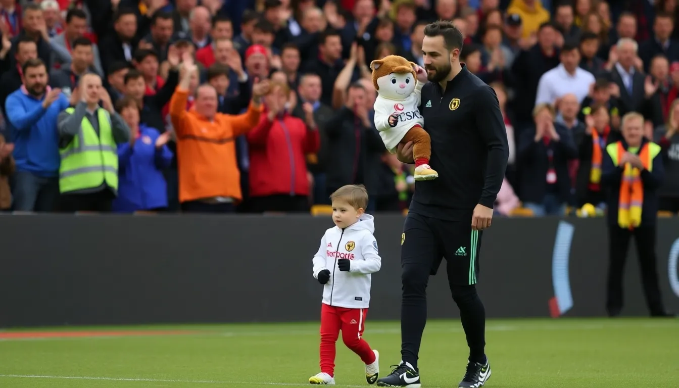 Diogo Jota's sons smile and wave as they stand alongside matchday mascots on the pitch at Anfield, creating a heartwarming scene during the prematch ceremony against Wolverhampton Wanderers.