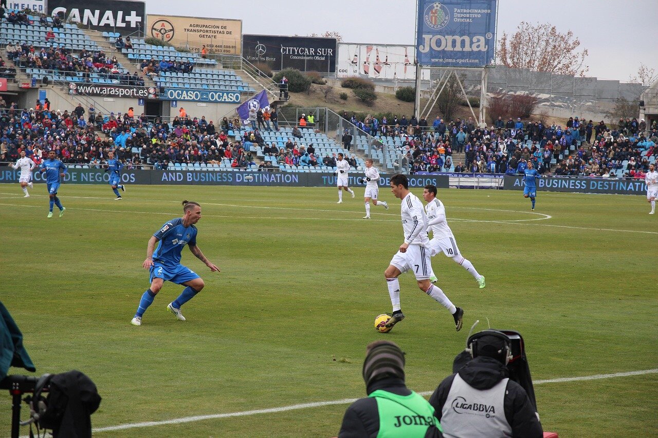 A dynamic scene of a live streaming event, where fans from around the world participate in realtime discussions about their favorite teams