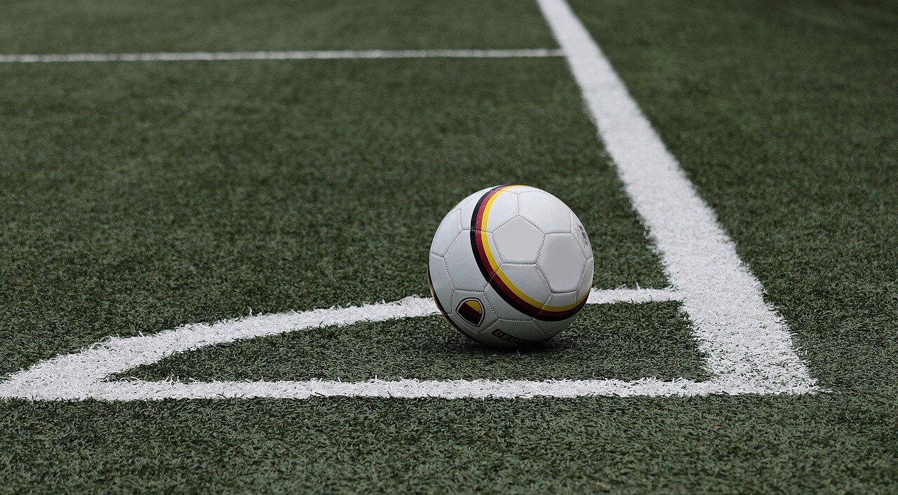A gathering of football officials discusses the intersection of sports and politics amid the ongoing controversy surrounding FIFA's leadership