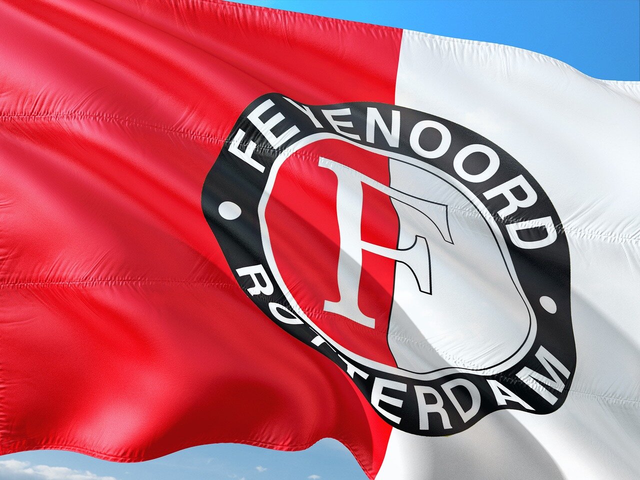 A training session at Feyenoord's facilities, showcasing players preparing for upcoming challenges as they adjust to the coaching transition