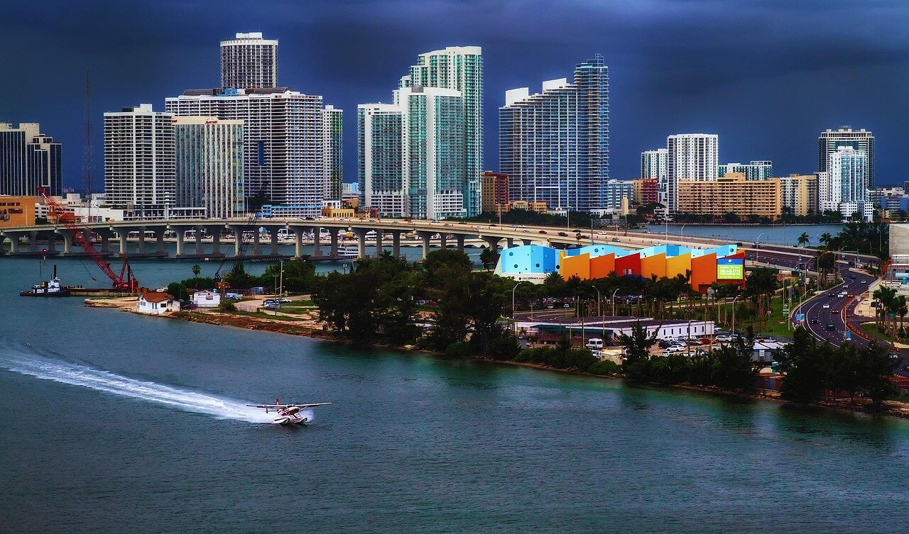 Fans gather in large numbers outside the Inter Miami CF stadium, waving flags and wearing merchandise to show their support for Messi and the team